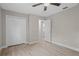 Bedroom featuring a closet with paneled doors, wood-look flooring, and an open doorway at 4870 Oriole Dr, St Cloud, FL 34772