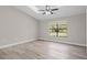 Bedroom features a ceiling fan, natural light from the window, and neutral walls at 4870 Oriole Dr, St Cloud, FL 34772