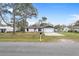 Charming home with a manicured front lawn, a driveway, and an attached garage at 4870 Oriole Dr, St Cloud, FL 34772