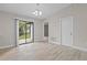 Living room with sliding glass doors to the backyard, allowing for indoor-outdoor living and natural light at 4870 Oriole Dr, St Cloud, FL 34772