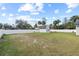 The expansive backyard with white fencing is perfect for outdoor activities at 516 8Th St, Orlando, FL 32820