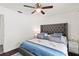 Comfortable bedroom featuring neutral tones, a tufted headboard, ceiling fan, and ample natural light at 516 8Th St, Orlando, FL 32820