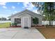 Inviting home exterior featuring a new paint job, green grass, and new landscaping at 516 8Th St, Orlando, FL 32820