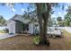 Charming single story home with a white picket fence, deck, and mature trees at 516 8Th St, Orlando, FL 32820