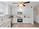 This beautifully remodeled kitchen features all-white cabinets and updated appliances at 516 8Th St, Orlando, FL 32820