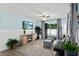 Cozy living room with blue accent wall, modern furniture, and sliding door access to the deck at 516 8Th St, Orlando, FL 32820