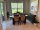 Bright dining room with large window, elegant decor, and a tranquil view at 5179 Royal Point Ave, Kissimmee, FL 34746