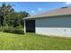 Exterior showing well-maintained backyard, lawn and screened-in patio at 5179 Royal Point Ave, Kissimmee, FL 34746