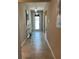 Bright hallway with tile flooring and elegant chandelier lighting fixture at 5179 Royal Point Ave, Kissimmee, FL 34746