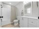 Bathroom with a shower-tub combination, toilet, and a white single-sink vanity with a mirror at 52 Bay Ridge Loop, Mascotte, FL 34753