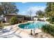 Well-maintained backyard featuring a sparkling pool, patio area and lush landscaping at 5359 Lanyard Ct, Winter Park, FL 32792