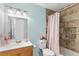 Well lit bathroom featuring a shower and tub combination with tiled walls at 5359 Lanyard Ct, Winter Park, FL 32792