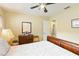 Cozy bedroom with a full size bed, window and a view to the hallway at 5359 Lanyard Ct, Winter Park, FL 32792