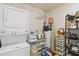 Organized laundry room with shelving and storage for all of your needs at 5359 Lanyard Ct, Winter Park, FL 32792