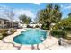 Serene pool with palm trees and outdoor seating at 5359 Lanyard Ct, Winter Park, FL 32792