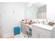 Bright bathroom with dual vanity, stylish mirror, modern lighting, and shower at 5590 Forest Ridge Dr, Winter Haven, FL 33881