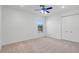 Clean bedroom with a window, ceiling fan and spacious closet for storage at 642 Osprey Lakes Cir, Chuluota, FL 32766