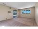 Bonus room with plush carpet, a large window, and sliding glass doors to an outdoor patio at 642 Osprey Lakes Cir, Chuluota, FL 32766