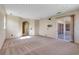 Living room with view of the outdoor patio through the sliding glass doors at 642 Osprey Lakes Cir, Chuluota, FL 32766