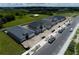 Aerial view of new homes under construction showing layout, landscaping, and neighborhood street at 6825 Yellow Warbler Bnd, St Cloud, FL 34773