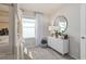 bedroom featuring a bunk bed, dresser with a round mirror, and neutral decor at 7054 Rosy Sky Ave, Orlando, FL 32829