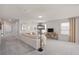 Upstairs living area with neutral colors, soft carpet, and comfortable seating, with a media center and lamps at 7054 Rosy Sky Ave, Orlando, FL 32829