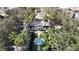 Aerial view of a clubhouse framed by palm trees and manicured landscaping at 770 Siena Palm Dr # 201, Kissimmee, FL 34747