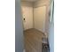 Entrance hall featuring wood flooring, closet, and modern art at 770 Siena Palm Dr # 201, Kissimmee, FL 34747