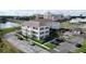 Aerial view of the condo showcasing beautiful landscaping and convenient parking at 770 Siena Palm Dr # 201, Kissimmee, FL 34747