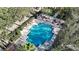 Overhead view of a refreshing pool with lounge chairs and lush surroundings at 770 Siena Palm Dr # 201, Kissimmee, FL 34747