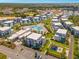 Aerial view of resort community featuring condos, playground, and community pool at 7770 Sandy Ridge Dr # 110, Reunion, FL 34747