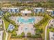 Resort aerial showing pool, cabanas, hot tub, community center, playground, and lush landscaping at 7770 Sandy Ridge Dr # 110, Reunion, FL 34747