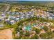 Aerial view of water park, green spaces, golf course and condos at 7770 Sandy Ridge Dr # 110, Reunion, FL 34747