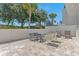 Spacious backyard patio, featuring outdoor seating, offers a serene space for relaxing and socializing at 7770 Sandy Ridge Dr # 110, Reunion, FL 34747