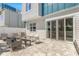 Spacious paved patio featuring outdoor lounge furniture and sliding glass doors, perfect for outdoor living at 7770 Sandy Ridge Dr # 110, Reunion, FL 34747