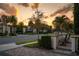 Scenic street view showcasing a well-maintained neighborhood with lush landscaping and charming homes at 8125 Via Vittoria Way, Orlando, FL 32819