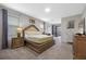 Serene main bedroom with a king bed, dresser, and sliding glass doors to the backyard at 9030 Sunshine Ridge Loop, Kissimmee, FL 34747