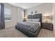 Main bedroom with a large decorative headboard and neutral decor at 9030 Sunshine Ridge Loop, Kissimmee, FL 34747