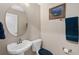 Powder room featuring pedestal sink and modern toilet at 932 Classic View Dr, Auburndale, FL 33823