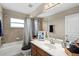 Bathroom with shower and tub combination, modern vanity with sink, and decorative mirror at 932 Classic View Dr, Auburndale, FL 33823