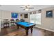 Spacious game room featuring a billiards table and hardwood floors at 932 Classic View Dr, Auburndale, FL 33823