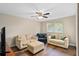 Bright living room featuring hardwood floors, comfortable seating, and a ceiling fan at 932 Classic View Dr, Auburndale, FL 33823