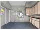 Utility room with gray walls, carpet floors and cabinets for extra storage at 127 Whitecaps Cir, Maitland, FL 32751