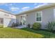 Charming backyard with a patio, manicured lawn, plants and an exterior view of the home at 1311 Travertine Ter, Sanford, FL 32771