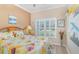 Comfortable bedroom with natural light, wooden headboard, and sunny decor at 1311 Travertine Ter, Sanford, FL 32771