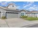 Two story gray home with a two car garage, manicured lawn and neatly trimmed hedges at 1311 Travertine Ter, Sanford, FL 32771