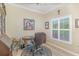 Well-lit office space featuring a desk, comfortable chair, and natural light from the window at 1311 Travertine Ter, Sanford, FL 32771