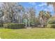 Well-maintained playground with green play structures and lush green surroundings, perfect for outdoor fun at 1311 Travertine Ter, Sanford, FL 32771