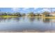 Scenic view of the community pond with fountain and surrounding homes at 1311 Travertine Ter, Sanford, FL 32771