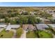 Aerial shot showing the home, driveway, lawn, and mature landscaping in the neighborhood at 1407 Dunsany Ave, Orlando, FL 32806